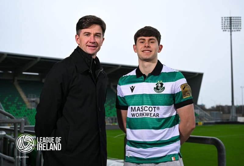 Shamrock Rovers player with club official at Tallaght Stadium, Dublin.